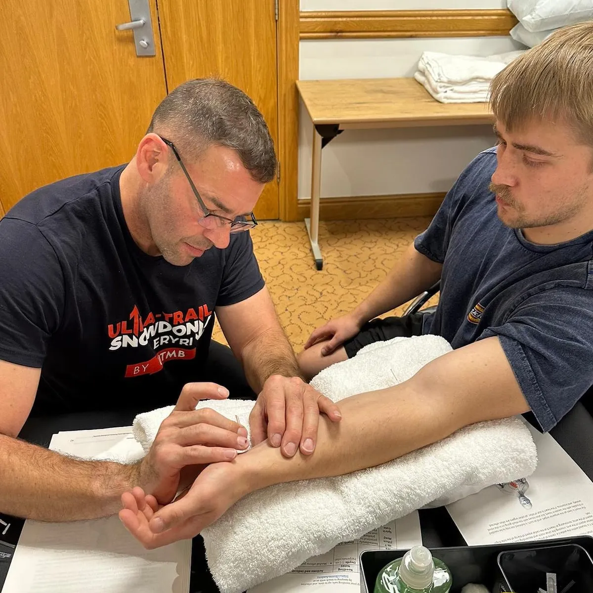acupuncture course attendee practicing needling partner